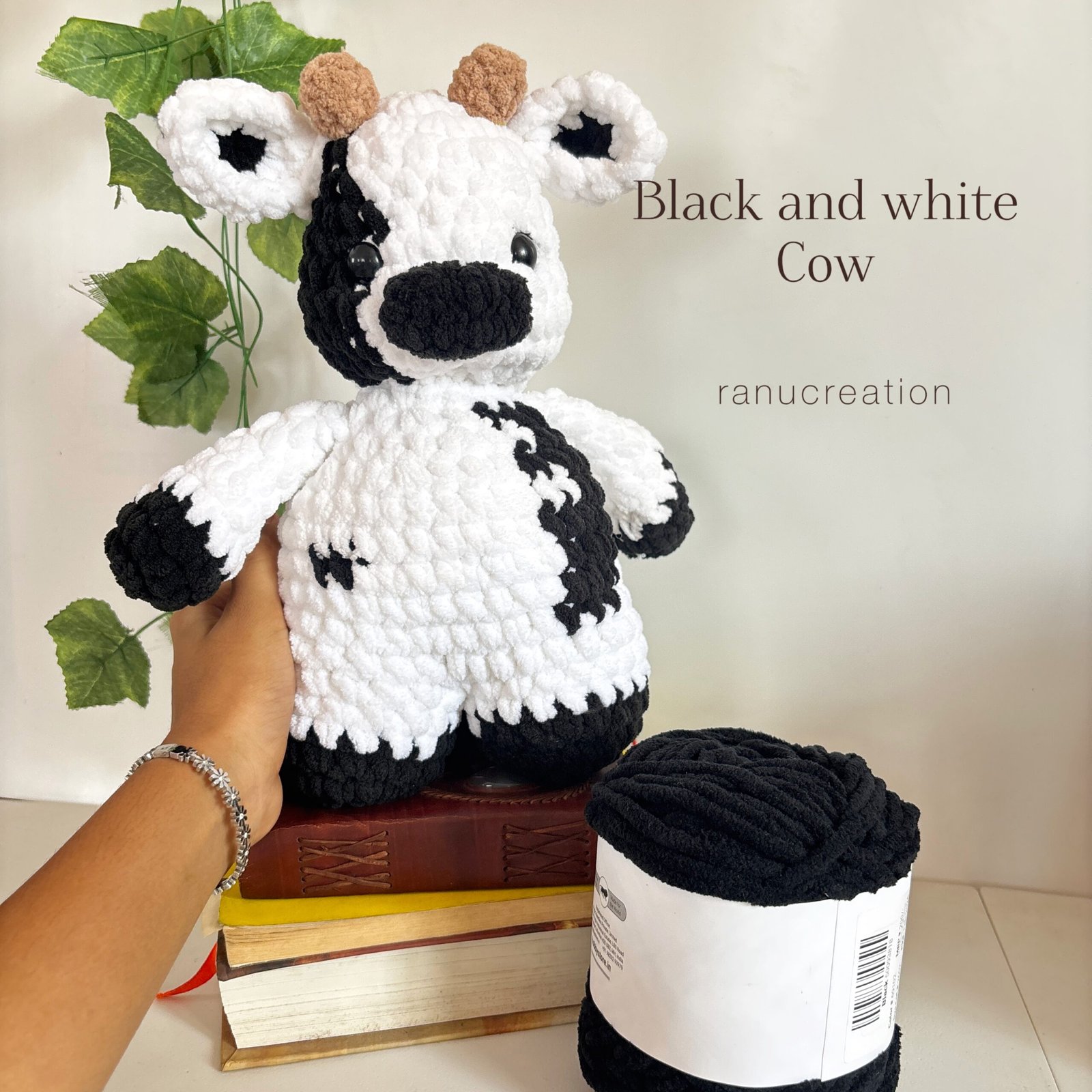 Black and white cow crochet plushie